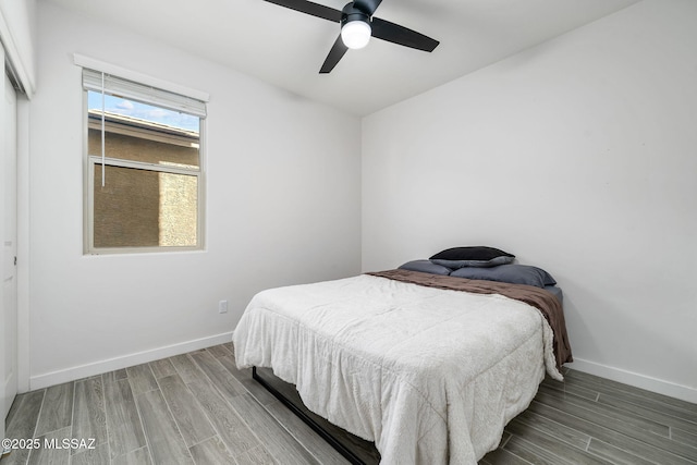 bedroom featuring hardwood / wood-style flooring and ceiling fan