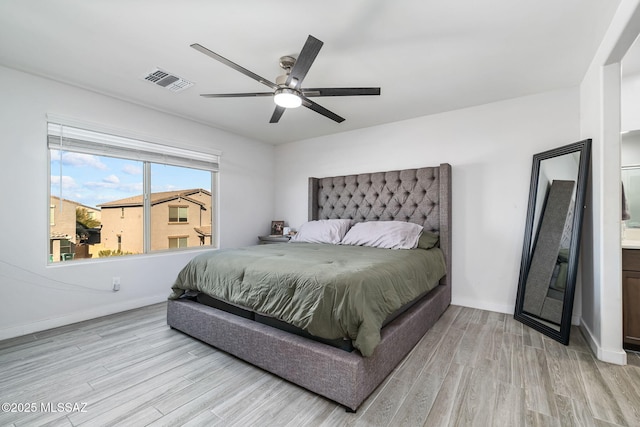 bedroom with ceiling fan and light wood-type flooring