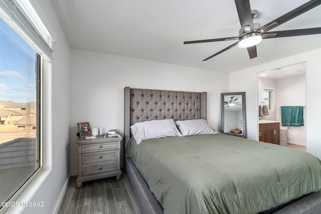 bedroom featuring ensuite bathroom, ceiling fan, and dark hardwood / wood-style flooring