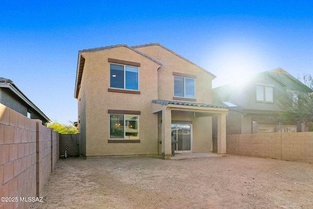 rear view of property with a patio area