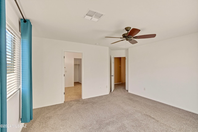 carpeted empty room with ceiling fan