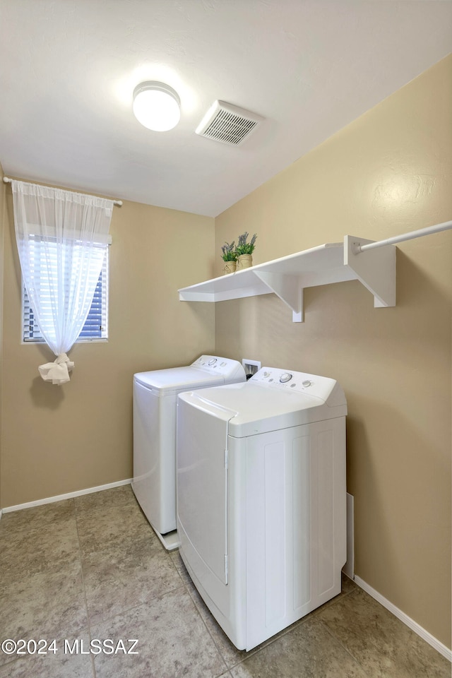 laundry room with separate washer and dryer