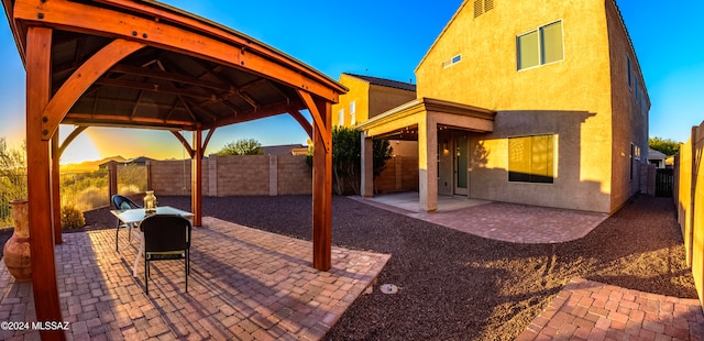 patio terrace at dusk with a gazebo