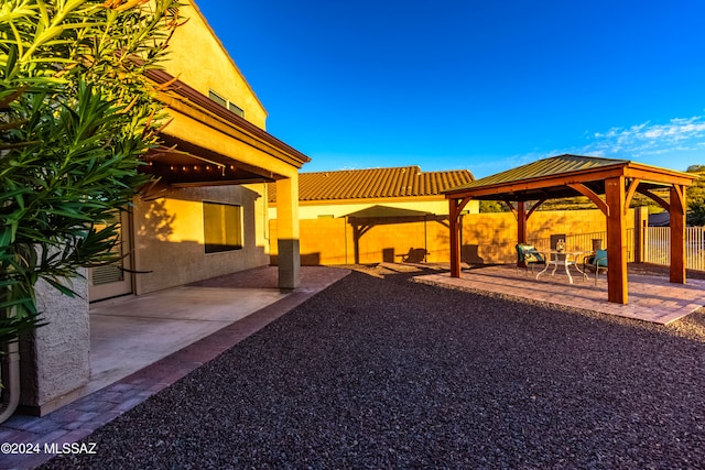 view of yard featuring a gazebo and a patio area