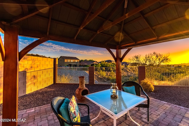 patio terrace at dusk with a gazebo