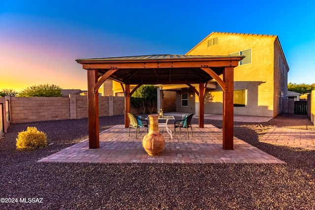 patio terrace at dusk with a gazebo