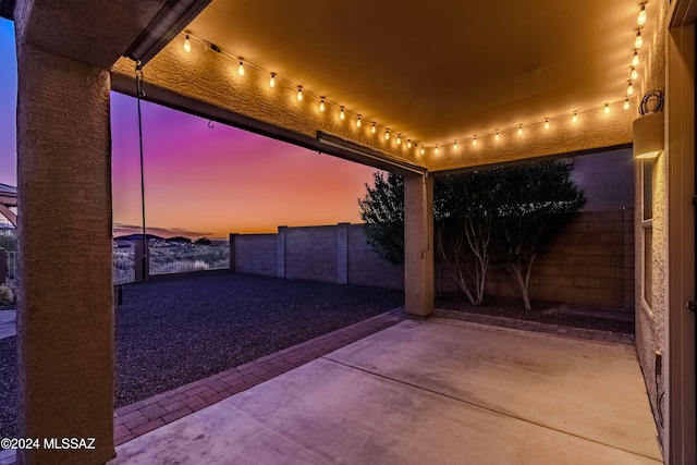 view of patio terrace at dusk