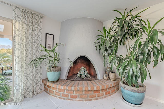 interior details with a brick fireplace