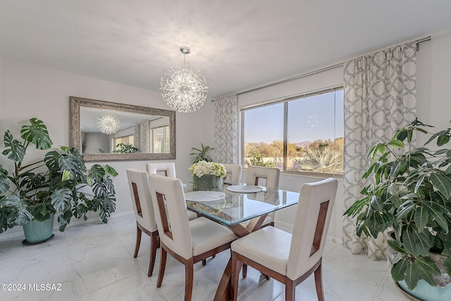 dining space with a notable chandelier