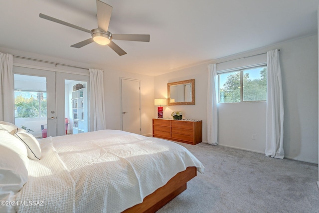 bedroom with ceiling fan, access to exterior, french doors, and multiple windows