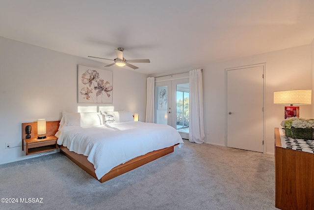 carpeted bedroom with french doors, access to outside, and ceiling fan