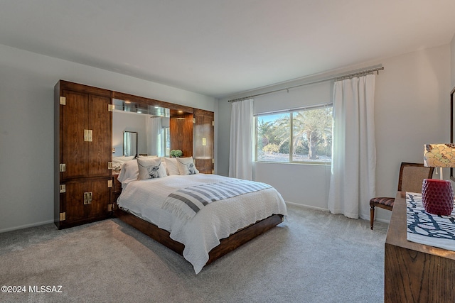 bedroom with light carpet