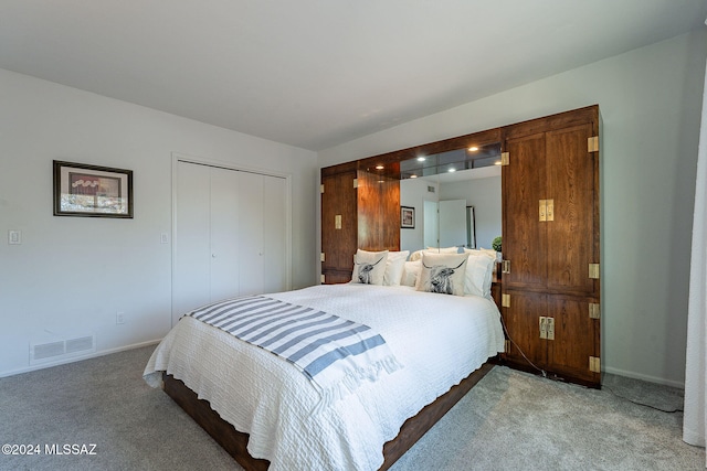 carpeted bedroom with a closet