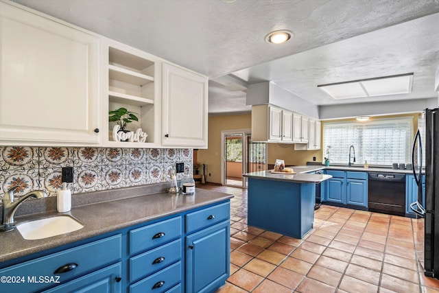 kitchen with a wealth of natural light, black dishwasher, white cabinets, and blue cabinets