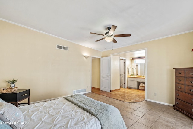 tiled bedroom featuring ceiling fan, ornamental molding, and connected bathroom