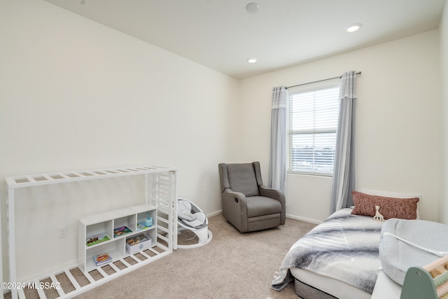 bedroom featuring light carpet