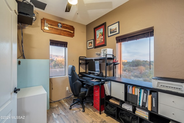 office area with light wood-type flooring and ceiling fan