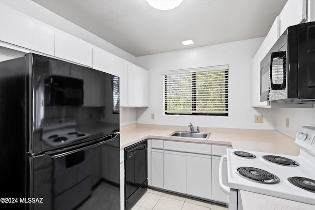 kitchen featuring light tile patterned floors, sink, white cabinetry, and black appliances