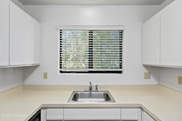 kitchen with white cabinets and sink