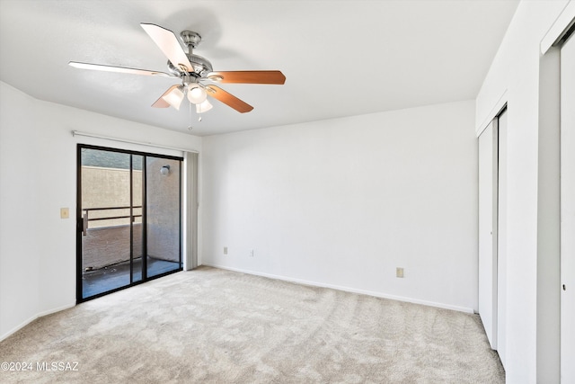 unfurnished bedroom with access to exterior, ceiling fan, a closet, and light colored carpet