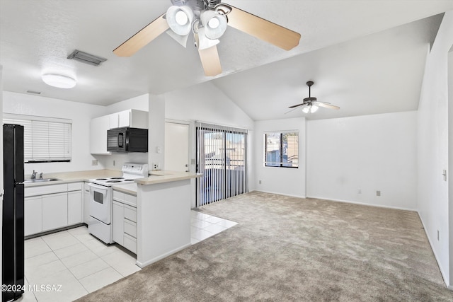 kitchen featuring sink, white electric range, light colored carpet, vaulted ceiling, and white cabinets