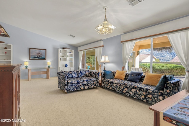 living room with an inviting chandelier, lofted ceiling, and carpet floors