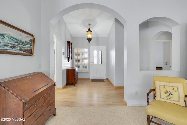 view of carpeted entrance foyer