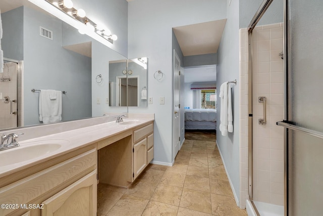 bathroom featuring vanity and a shower with door