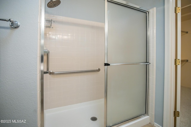 bathroom with a shower with shower door