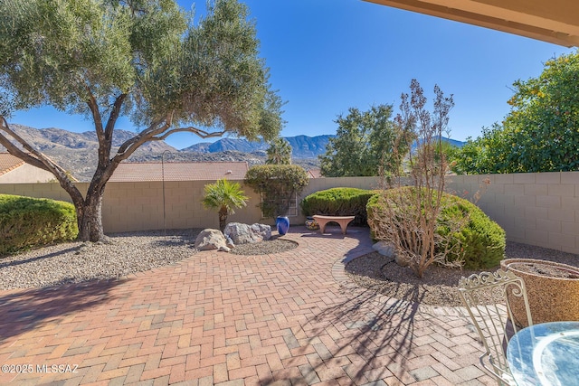 view of patio with a mountain view