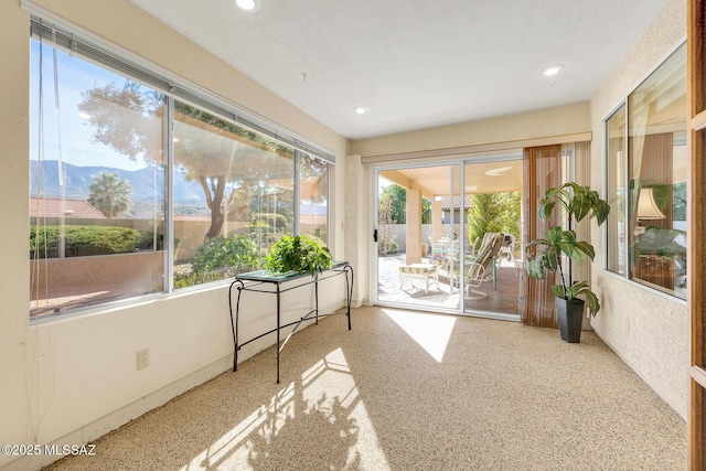 sunroom with a mountain view