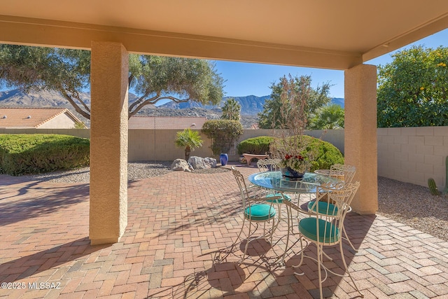 view of patio / terrace with a mountain view