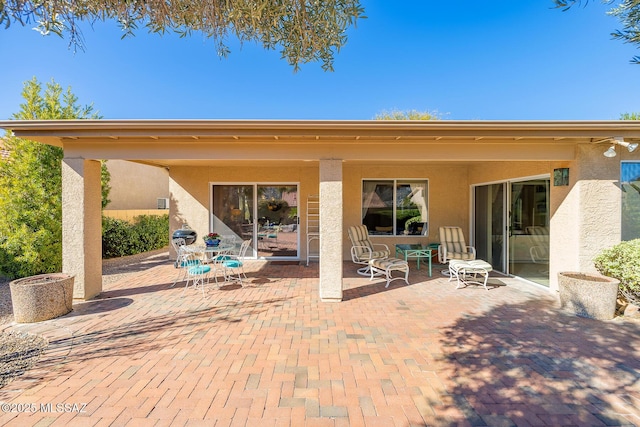 back of property featuring a patio area