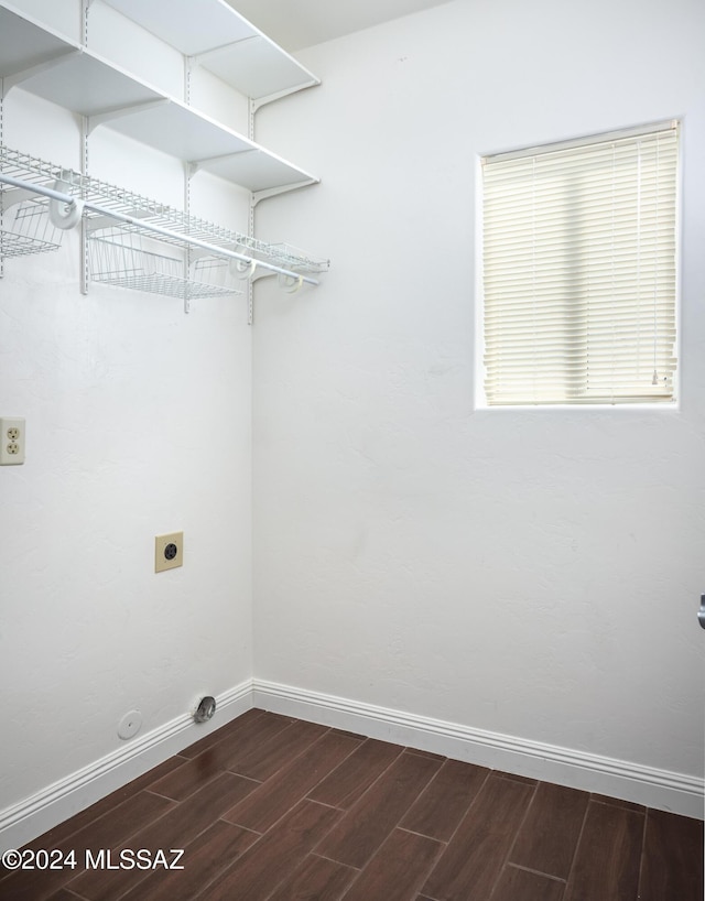 laundry room featuring hookup for an electric dryer and dark hardwood / wood-style floors