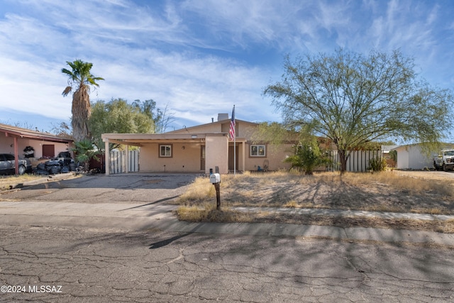 single story home with a carport