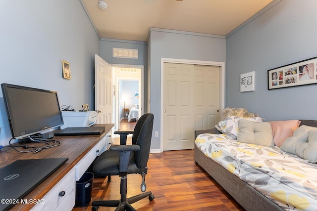 office space featuring hardwood / wood-style flooring and ornamental molding