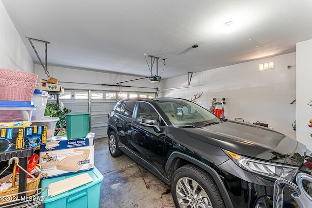 garage featuring a garage door opener