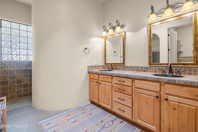 206 Circulo Veranera, Tubac, AZ 85646 - full bathroom with double vanity, tile patterned floors, and tasteful backsplash