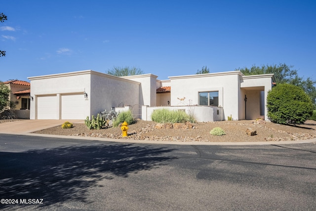 206 Circulo Veranera, Tubac, AZ 85646 - view of front of home featuring stucco siding, a garage, concrete driveway, and a tile roof