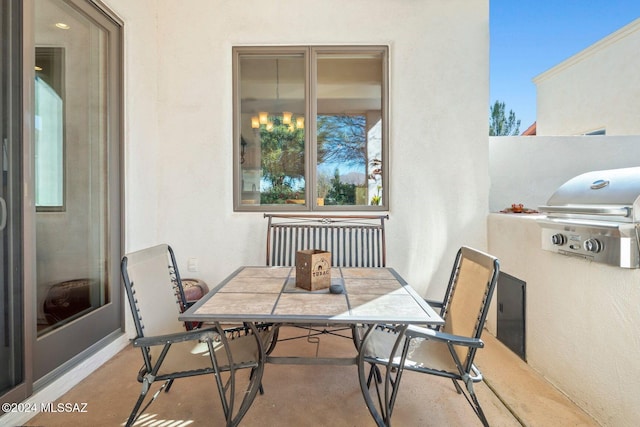 view of patio / terrace featuring grilling area and radiator heating unit