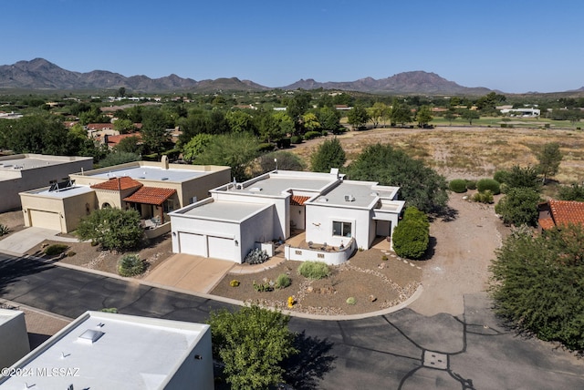 birds eye view of property with a mountain view