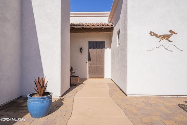 206 Circulo Veranera, Tubac, AZ 85646 - view of exterior entry featuring stucco siding and a tiled roof