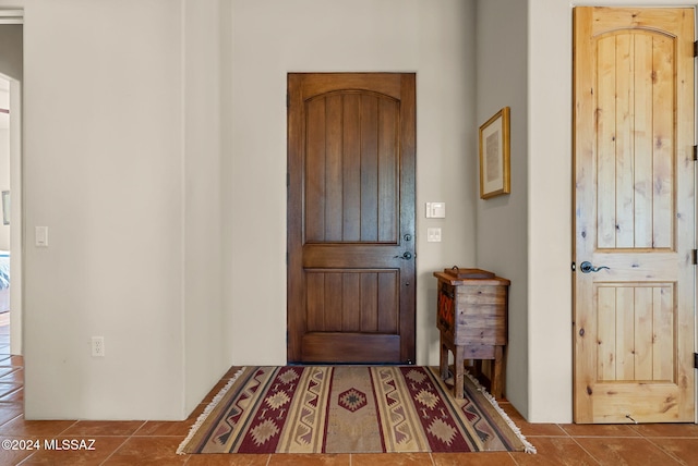 foyer entrance with tile patterned floors