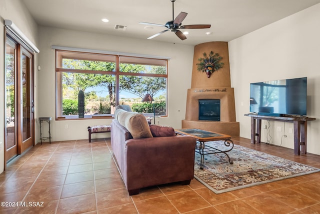 206 Circulo Veranera, Tubac, AZ 85646 - tiled living area with a fireplace, ceiling fan, and recessed lighting