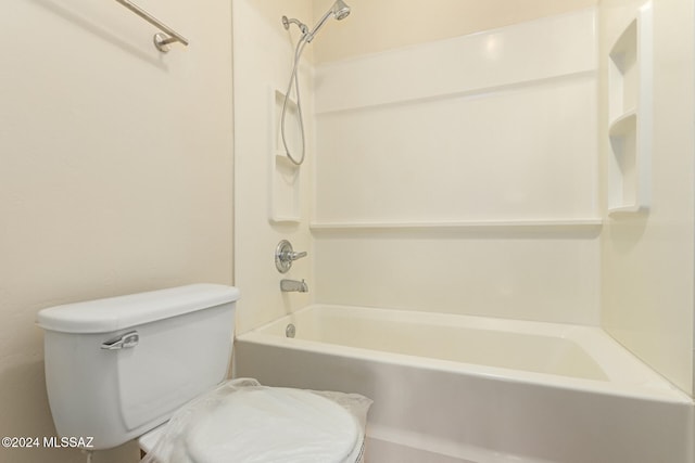 bathroom with toilet and tub / shower combination