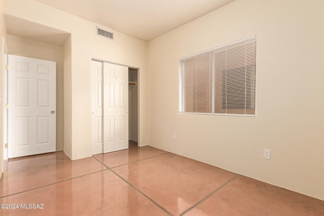 unfurnished bedroom with a closet