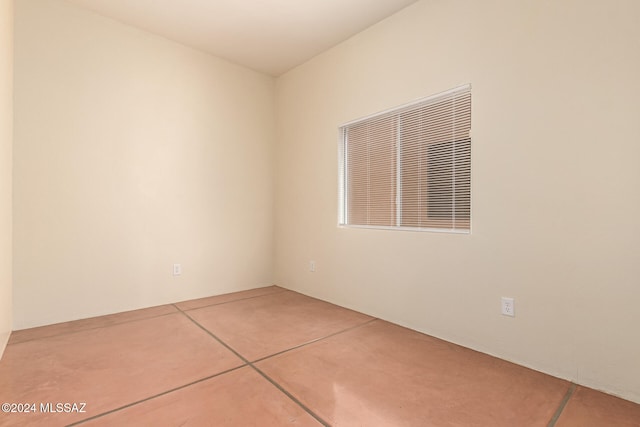 spare room featuring tile patterned flooring