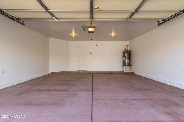 garage featuring a garage door opener and water heater