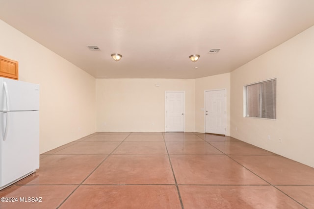 garage with white fridge