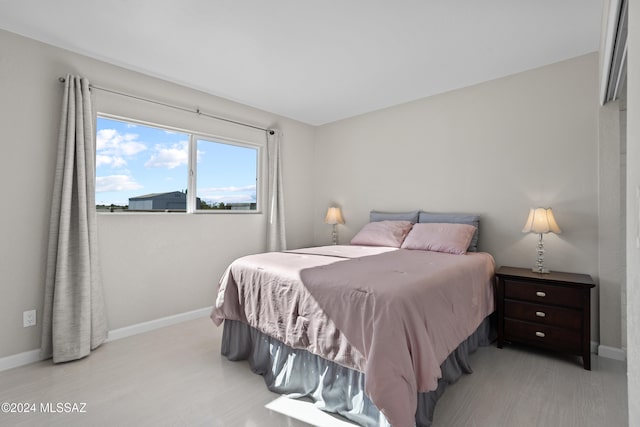 bedroom featuring light wood-type flooring